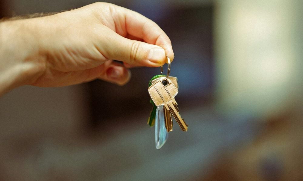 A person holding a bunch of keys in their hand
